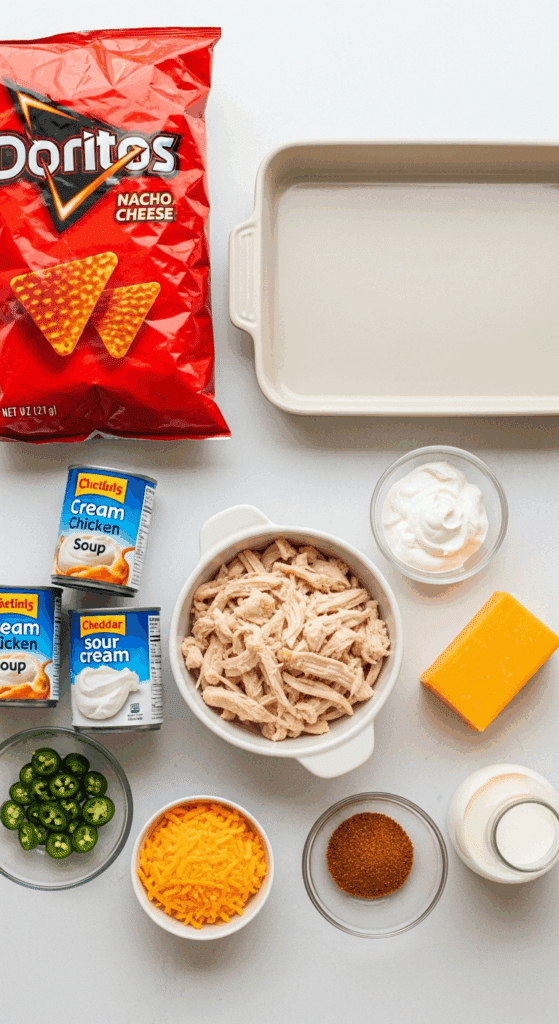 Ingredients for Doritos Chicken Casserole: Doritos, cooked chicken, cream of chicken soup, sour cream, and cheese.