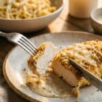 An enticing action shot. The focus is on the "perfect bite"—the combination of meat, crust, and sauce all on the fork, making the viewer hungry.