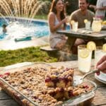 A pan of banana split ice cream cake being served at a pool party.