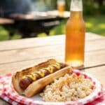 A context shot showing the salad in its natural environment—next to grilled meats.