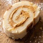 Close-up of a peanut butter pinwheel candy showing the fudge texture.