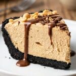 Close-up side view of a slice of peanut butter pie showing the fluffy mousse texture.