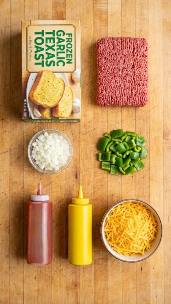Flat lay of ingredients including a box of Texas Toast, ground beef, and cheese.